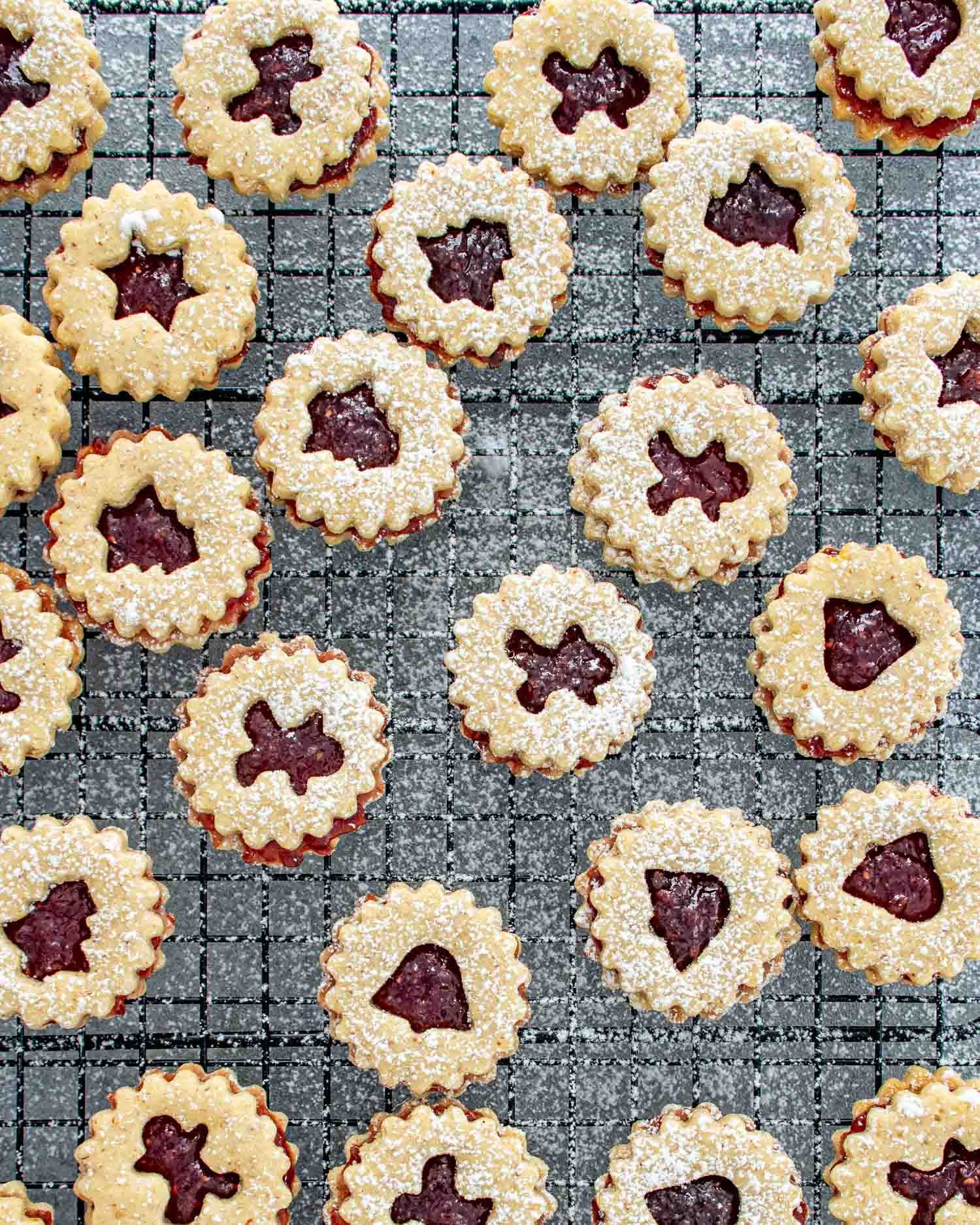 linzer cookies cooling on a cooling rack.
