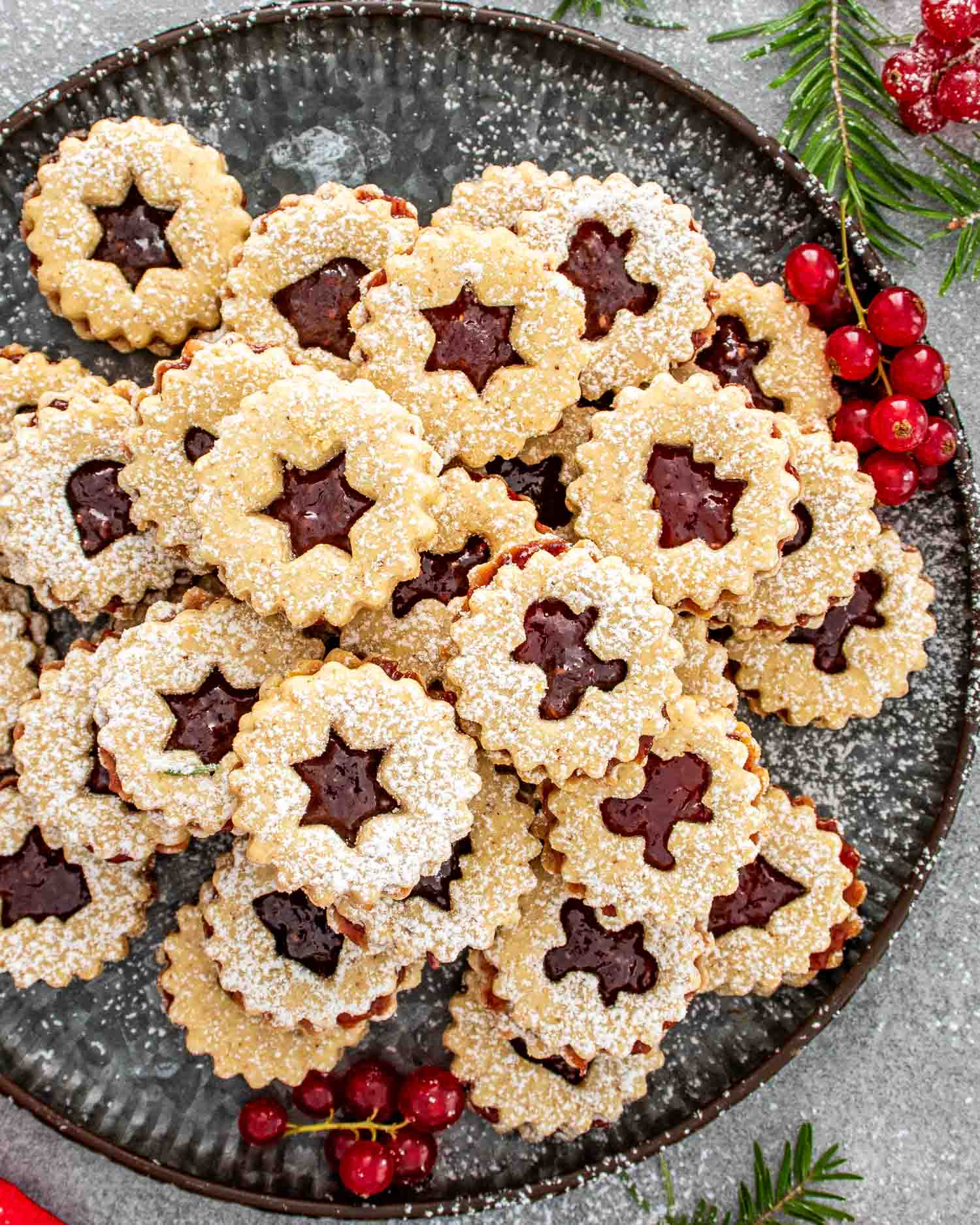 a plate with linzer cookies.