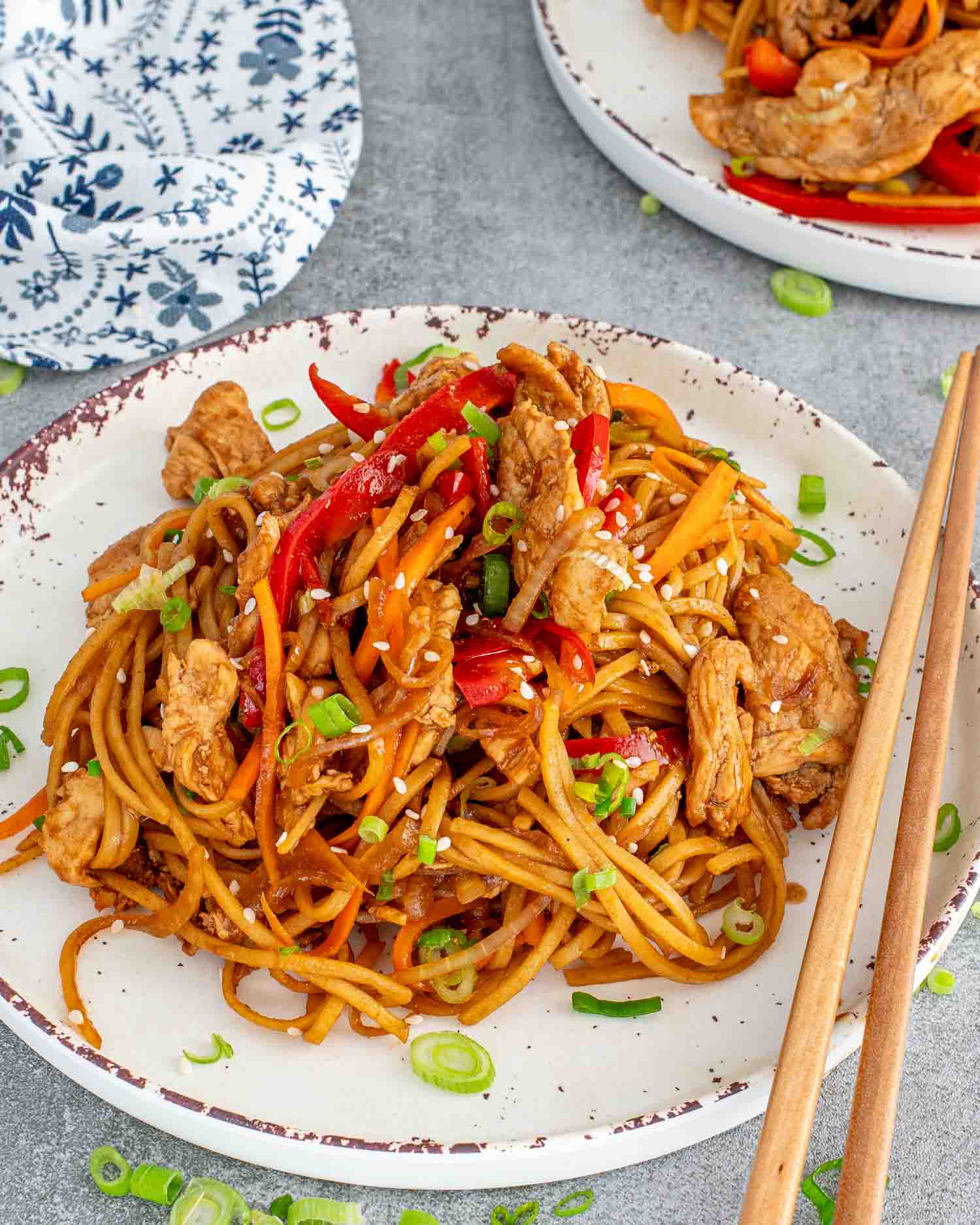 a serving of lo mein on a white plate.