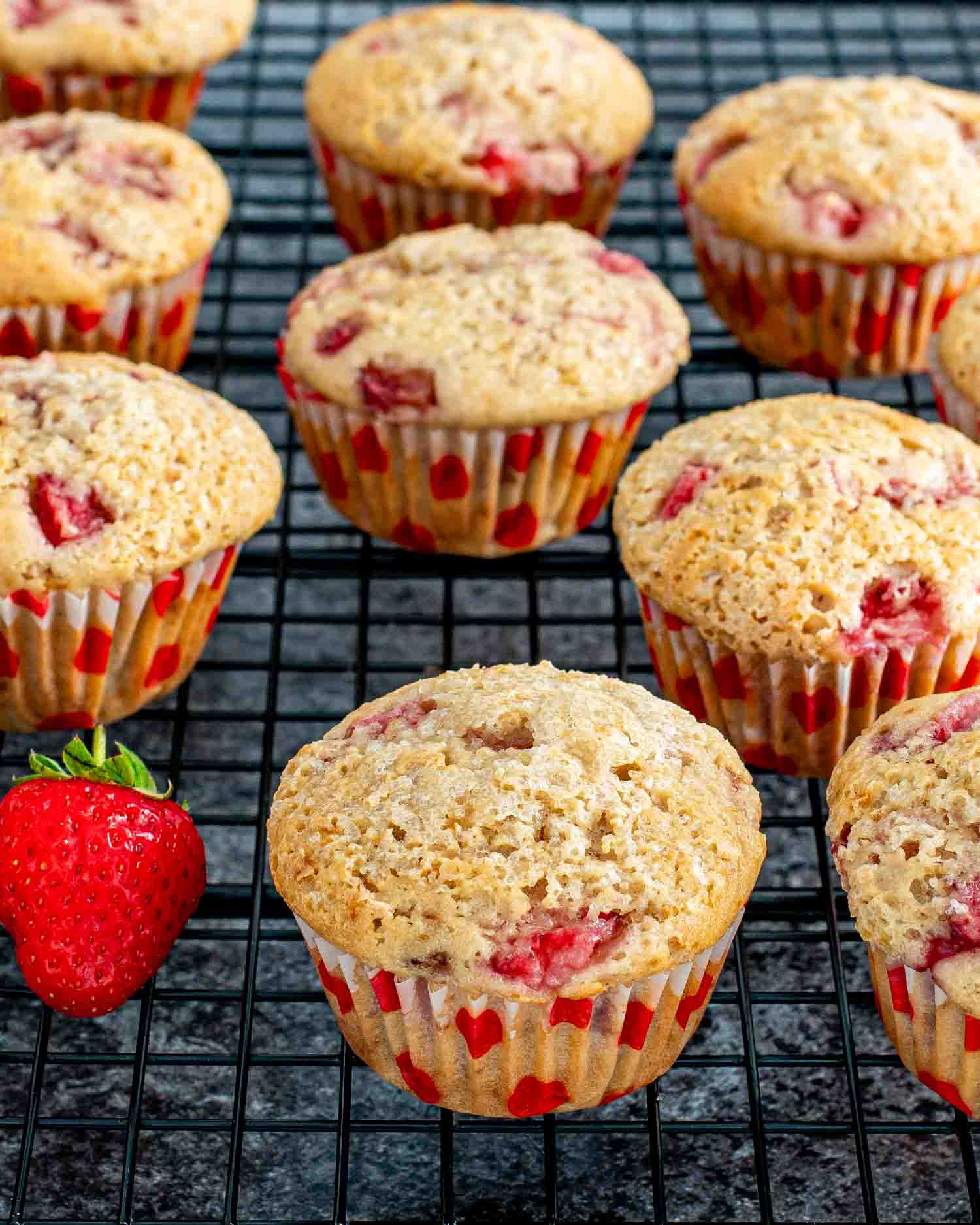 strawberry muffins on a cooling rack.