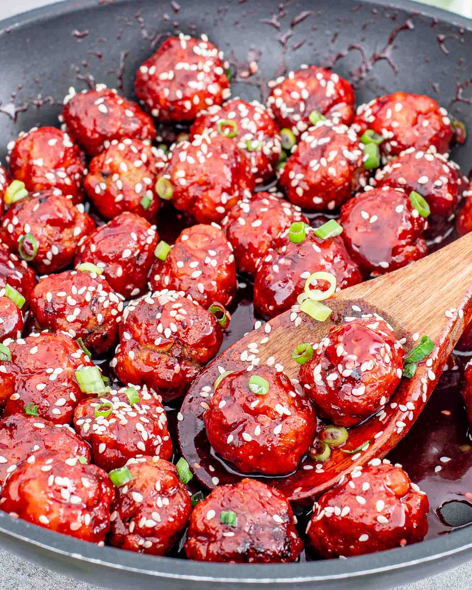 freshly made sweet and sour chicken meatballs in a skillet.