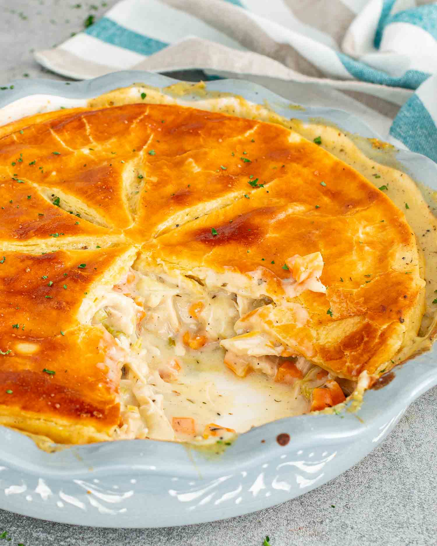 freshly baked chicken and leek pie in a pie dish.