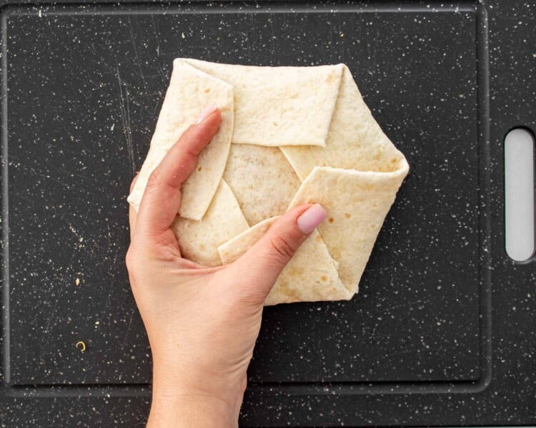 process shots showing how to make taco bell crunchwrap supreme.