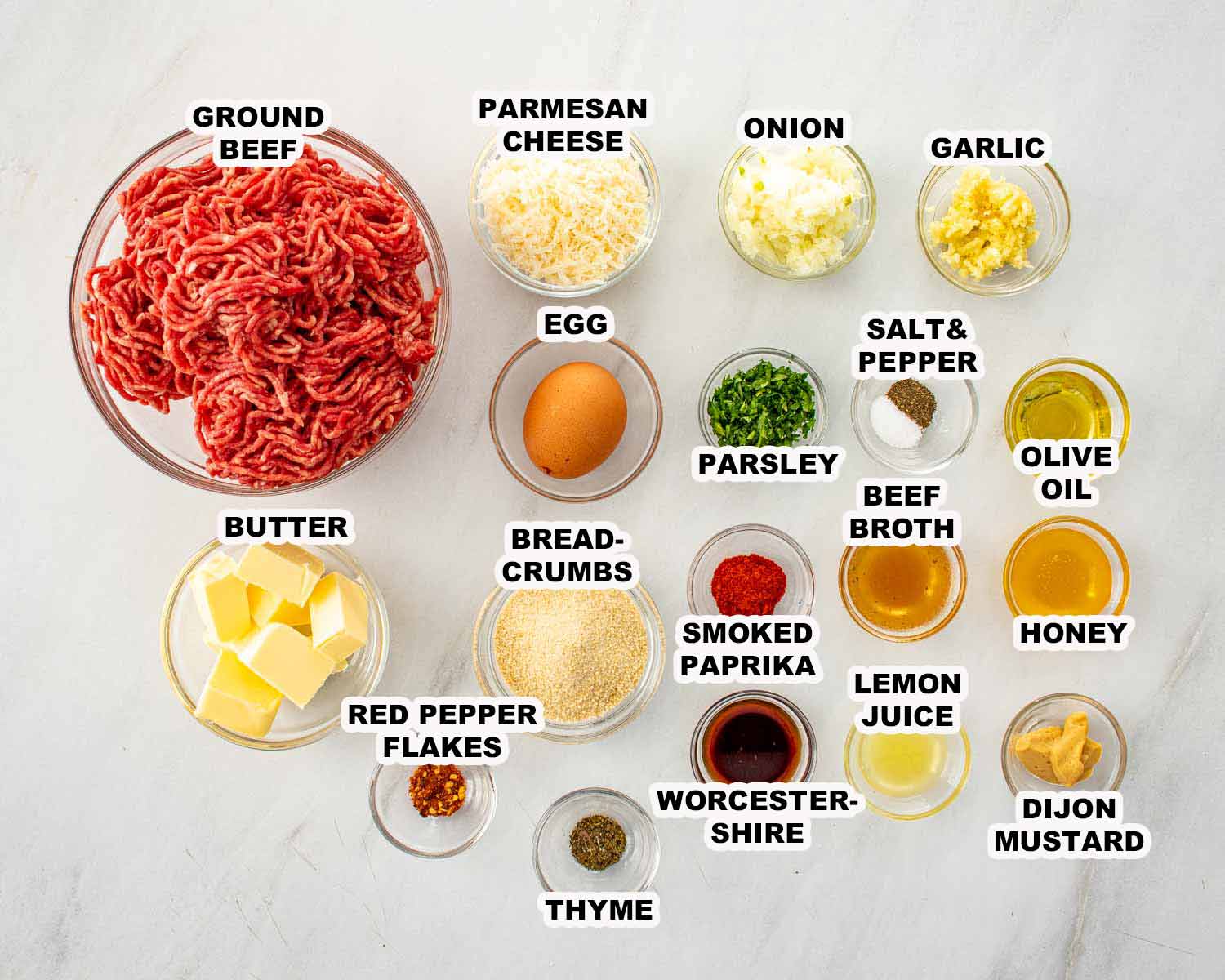 Ingredients for cowboy butter meatballs including ground beef, Parmesan, breadcrumbs, garlic, onion, butter, lemon juice, Dijon mustard, and spices.