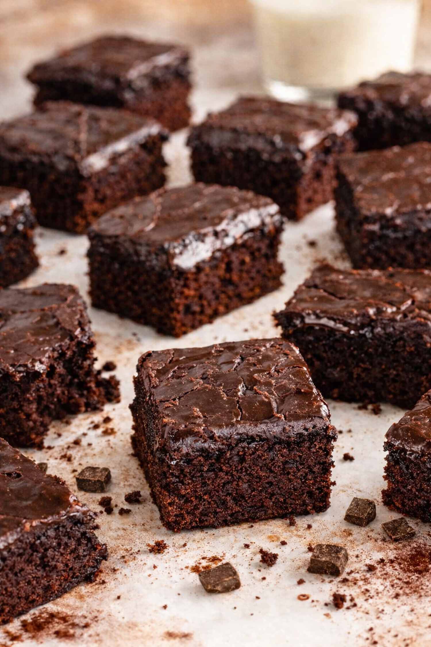 Chocolate lunch lady brownies with shiny frosting layer, cut into squares showing tender fudgy interior and classic school cafeteria style texture.