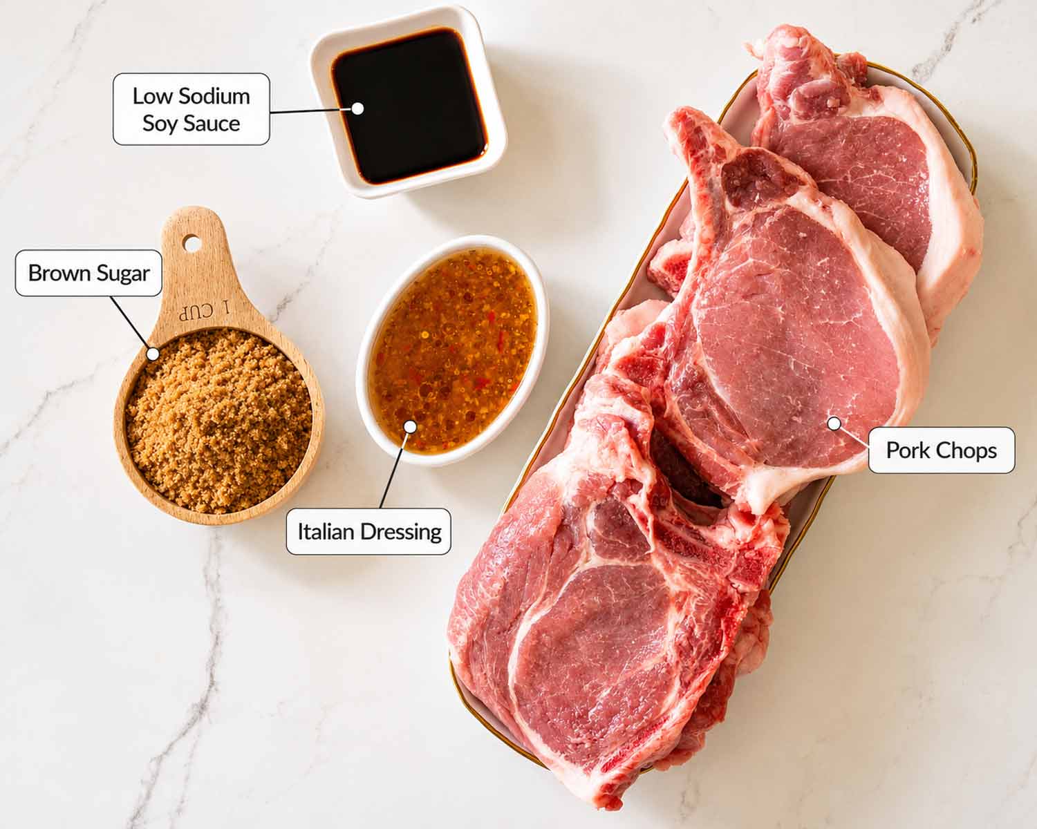 Ingredient lineup for brown sugar Italian pork chops including bone-in pork chops, brown sugar, Italian dressing, and soy sauce.