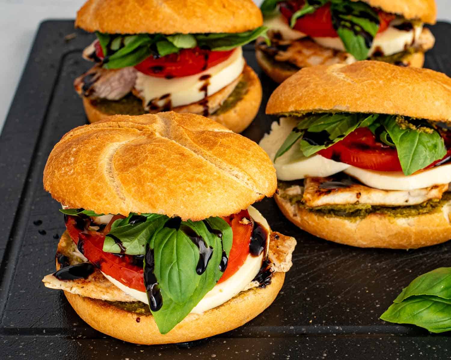 process shots showing how to make grilled chicken caprese sandwich.