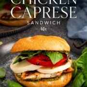 Pinterest graphic featuring a grilled chicken Caprese sandwich with elegant recipe title over a rustic food photography background.