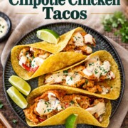 Three saucy chipotle chicken tacos with lime wedges beneath a green recipe title, finished with Craving Home Cooked branding.
